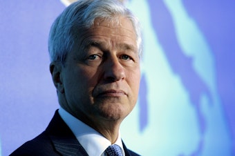 caption: JPMorgan Chase CEO Jamie Dimon says the coronavirus pandemic will have devastating consequences for the global economy.