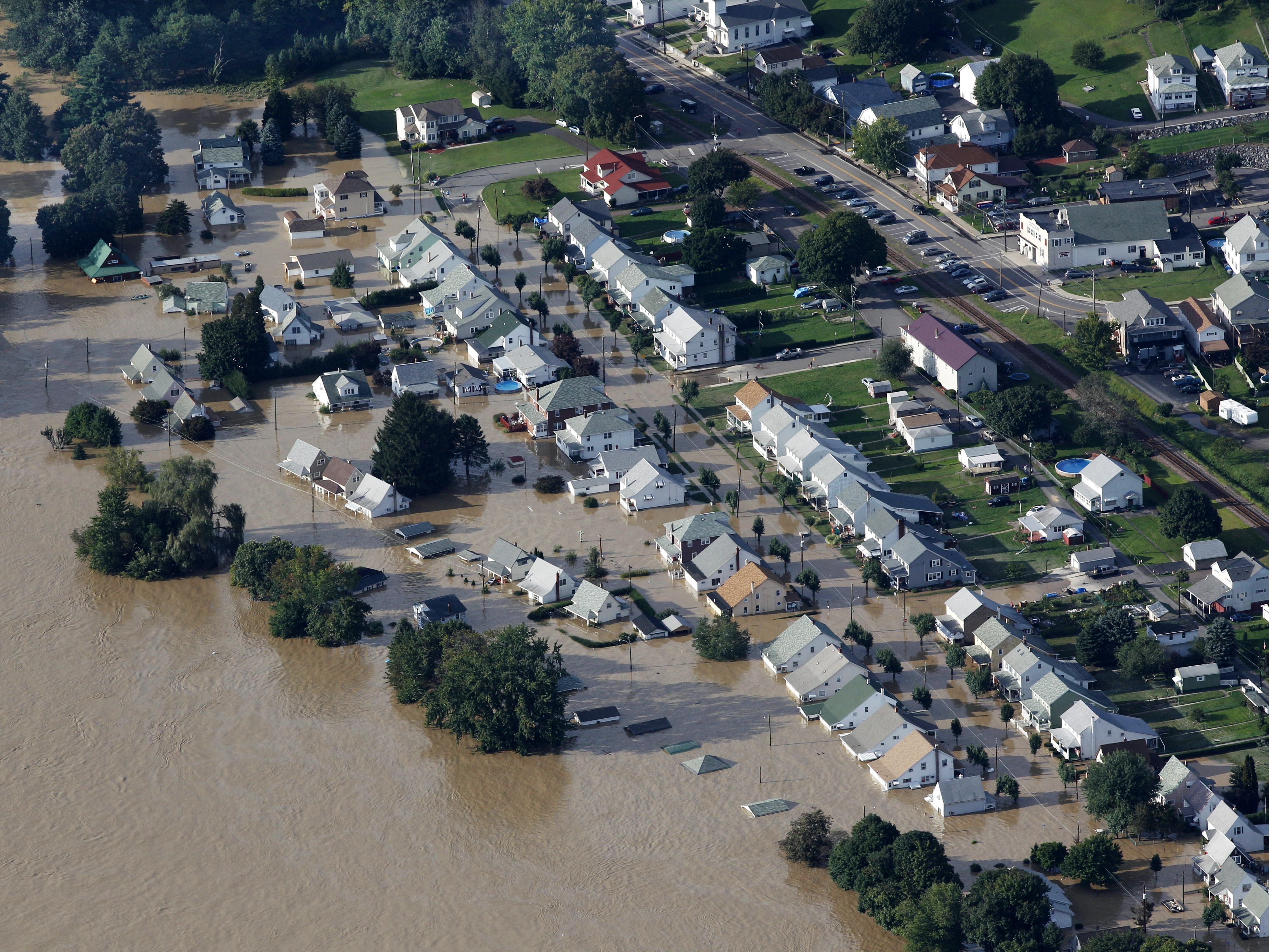 caption: A neighborhood near Wilkes-Barre, Pa., is flooded in September 2011, after heavy rain caused the Susquehanna River to rise dramatically.