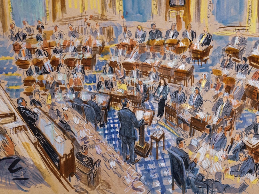 caption: A sketch artist's rendering of White House counsel Pat Cipollone speaking in the Senate chamber during the impeachment trial against President Trump on Jan. 21. In the trial, senators play the role of jurors, and Chief Justice John Roberts presides.