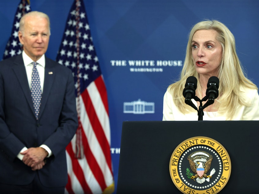 caption: Lael Brainard speaks as President Joe Biden listens during an announcement in Nov. 2021.