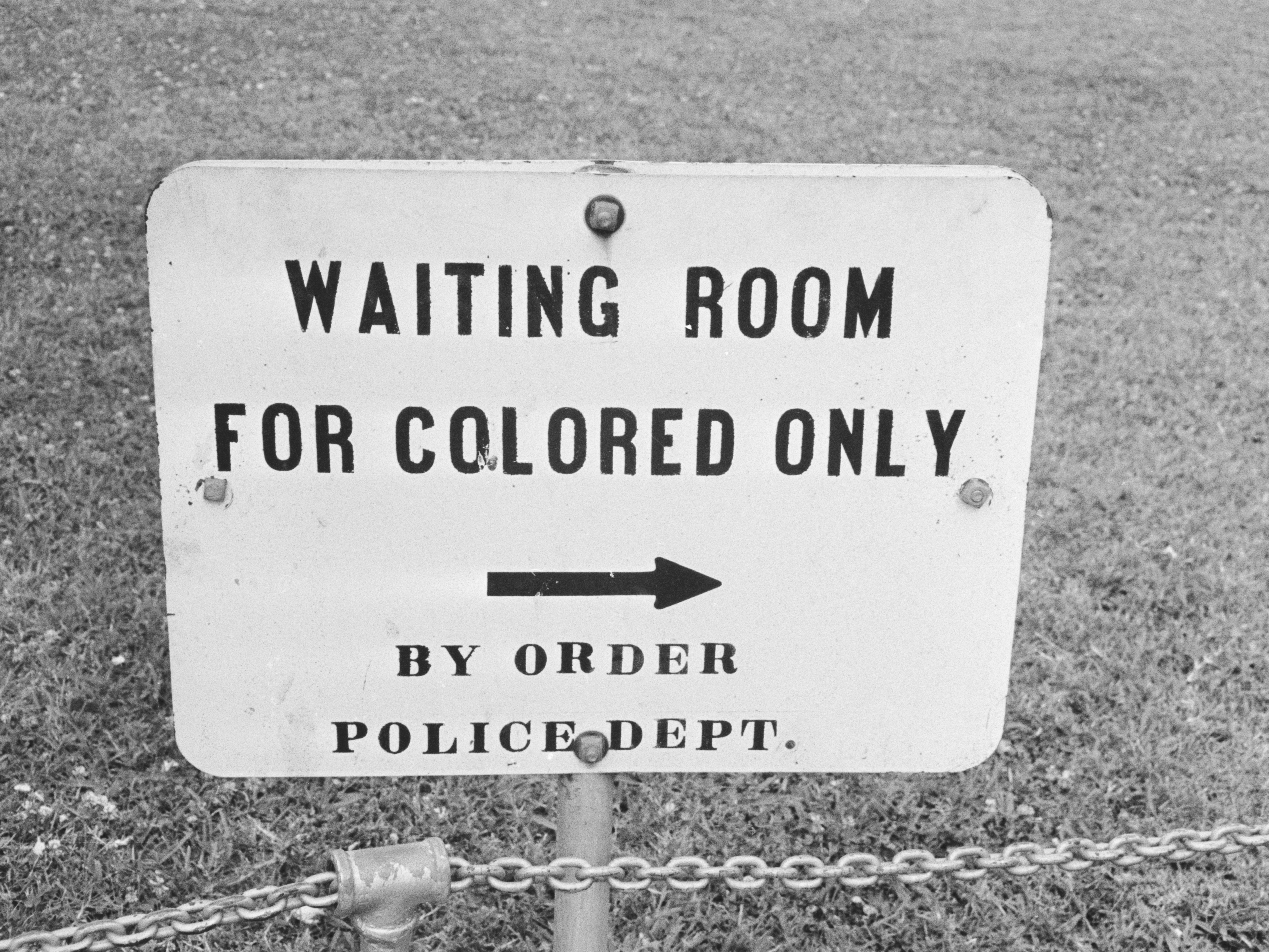 caption: A sign in Jackson, Miss., in May 1961. The contract clause deleted from federal regulations last month dated back to the mid-1960s and specifically said entities doing business with the government should not have segregated waiting rooms, drinking fountains or transportation.