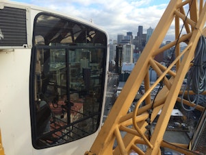 caption: A harrowing climb to the top of one of Seattle's construction cranes.