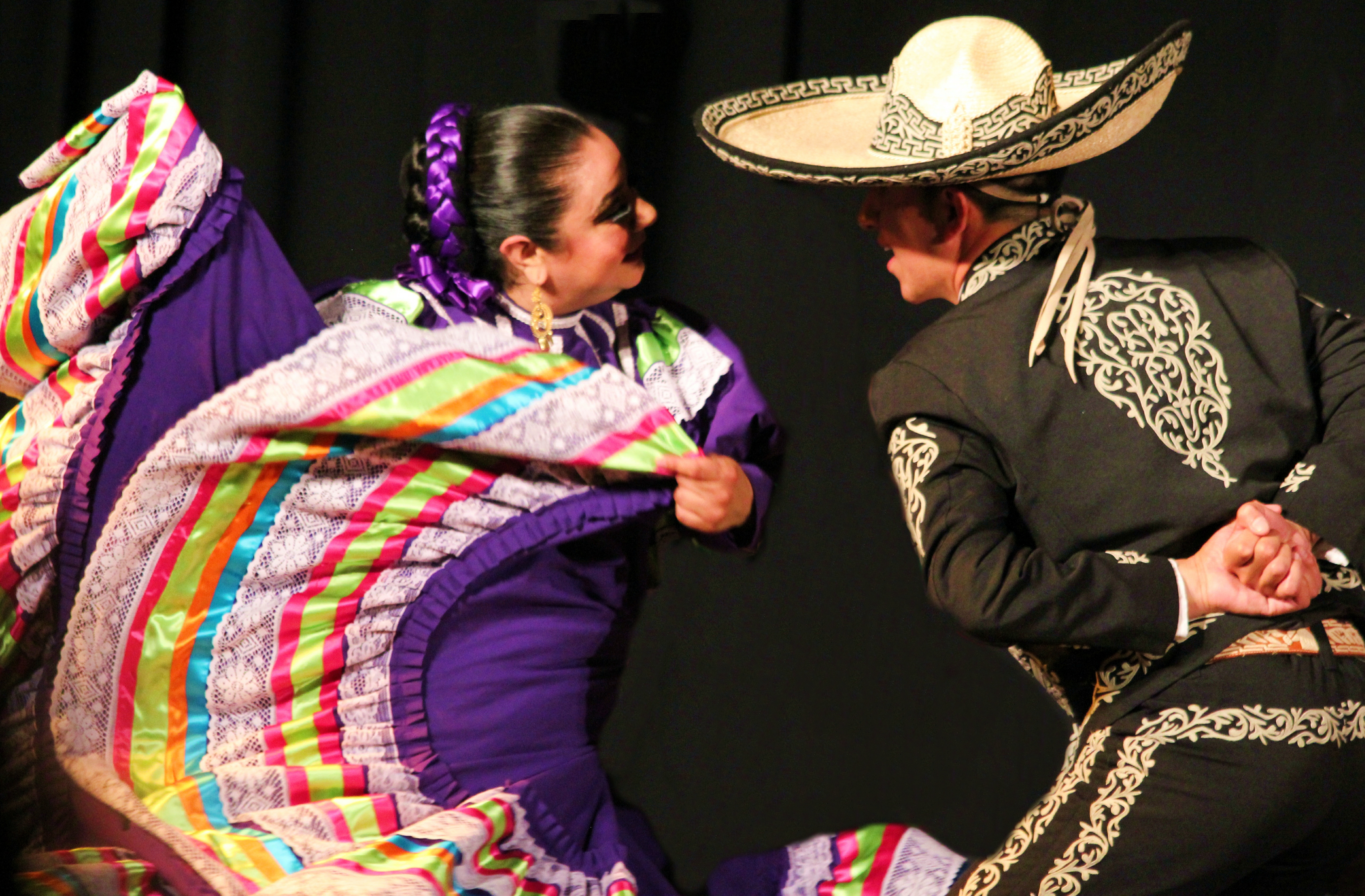caption: Dancers from the Seattle troupe Bailodores de Bronce, in performance. Tap on image for more pictures.