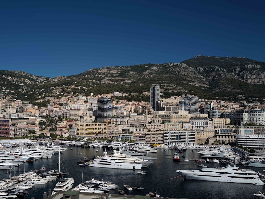 caption: A journalist-led investigation found that a woman had acquired a waterfront property in Monaco after she reportedly had a child with Russian President Vladimir Putin. Here, yachts are seen moored at the Hercules Port in Monaco.