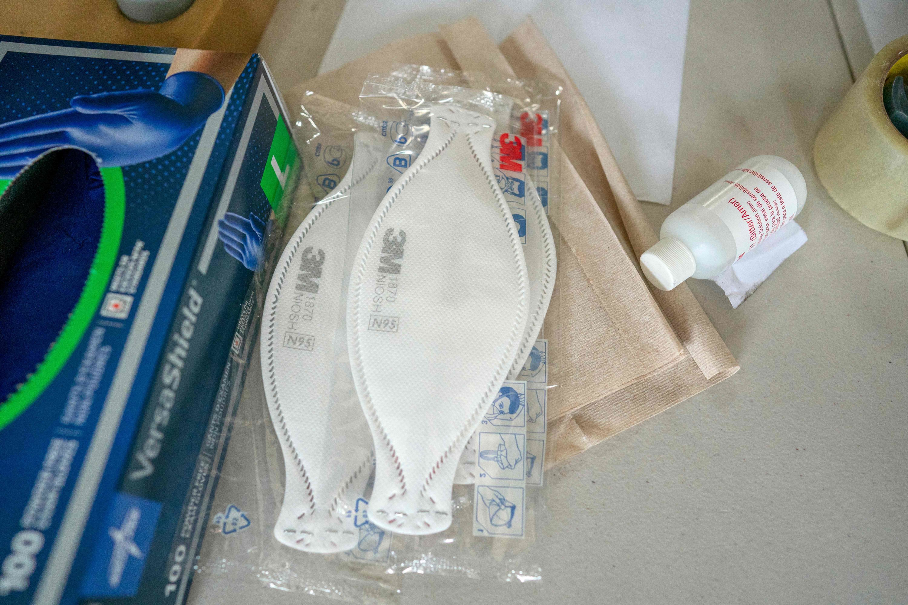 caption: N95 masks wait for deployment at the Anne Arundel County Fire Department supply depot on April 9, 2020 in Glen Burnie, Maryland. (Alex Edelman/AFP via Getty Images)