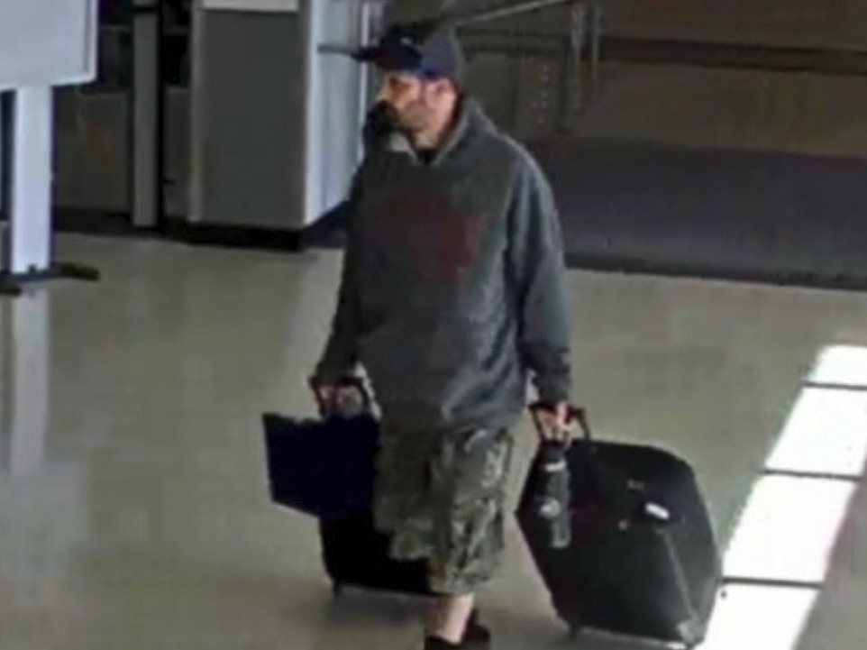 caption: This airport surveillance camera image released in an FBI affidavit shows alleged suspect Marc Muffley at Lehigh Valley International Airport in Allentown, Pa., on Monday.