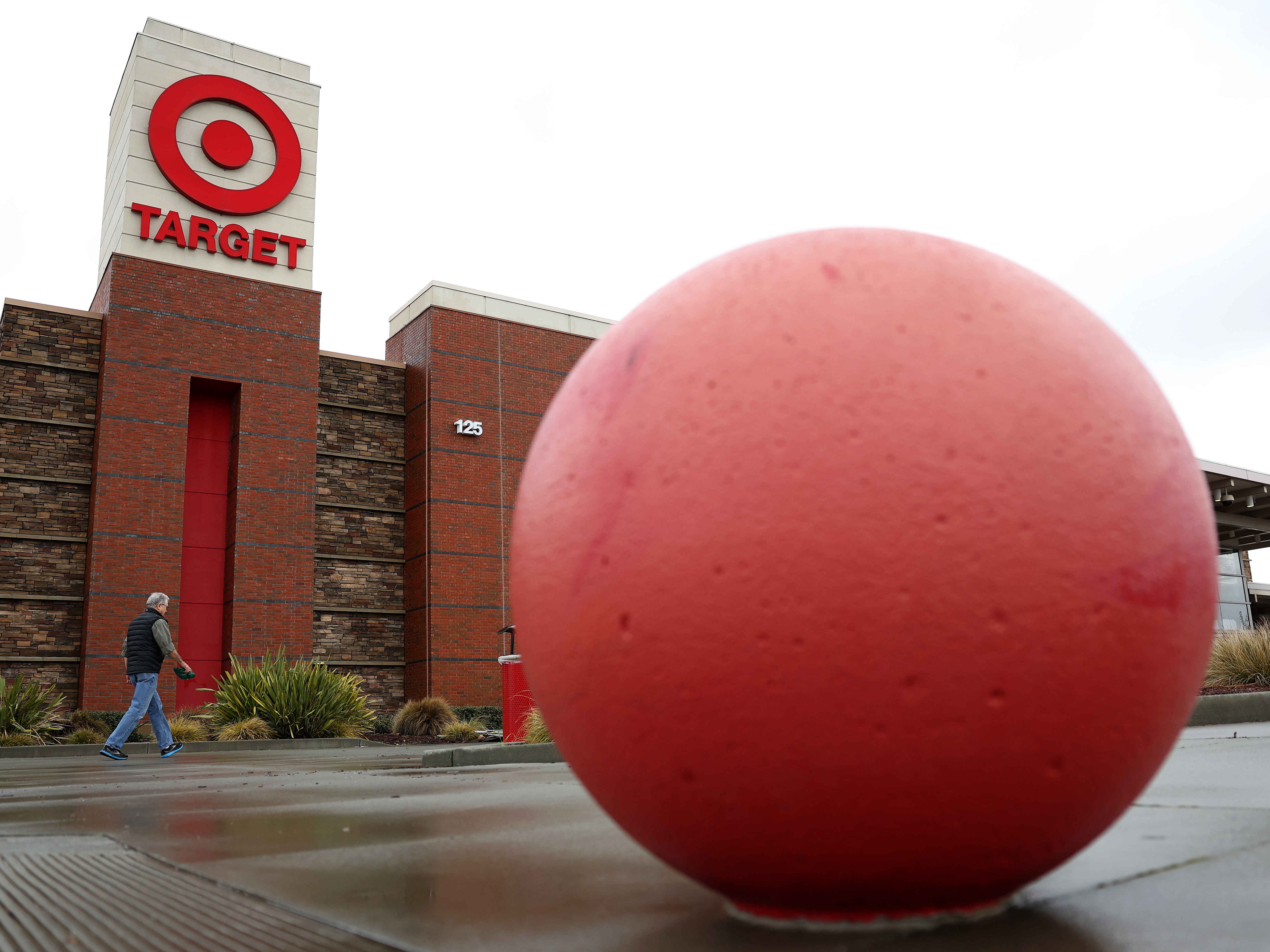 caption: A customer walks into a Target store on Feb. 28 in San Rafael, Calif.