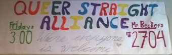 caption: A banner advertising the Queer-Straight Alliance at Interlake High School in Bellevue.