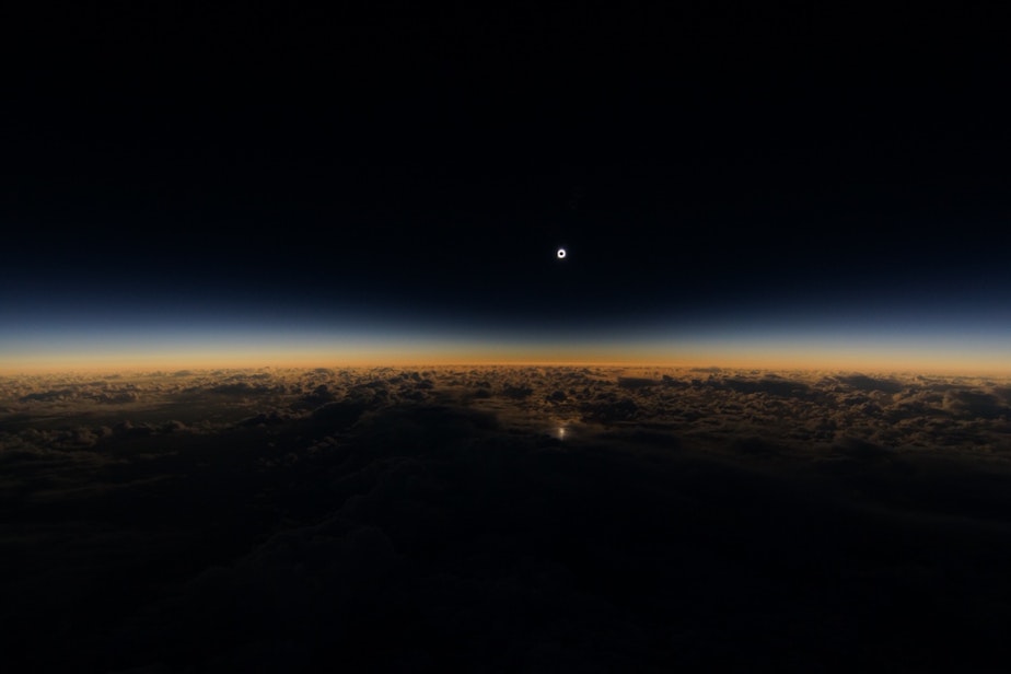 caption: Tuesday's solar eclipse as seen from Alaska Airlines flight 870