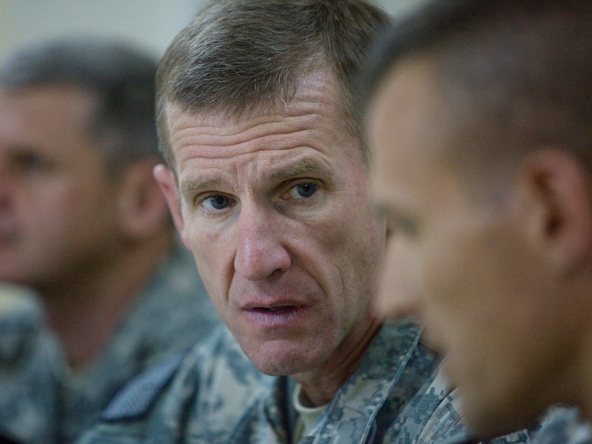 caption: Commander Gen. Stanley A. McChrystal (center) meets with high-ranking military personnel on Oct. 7, 2009  outside of Kandahar, Afghanistan.