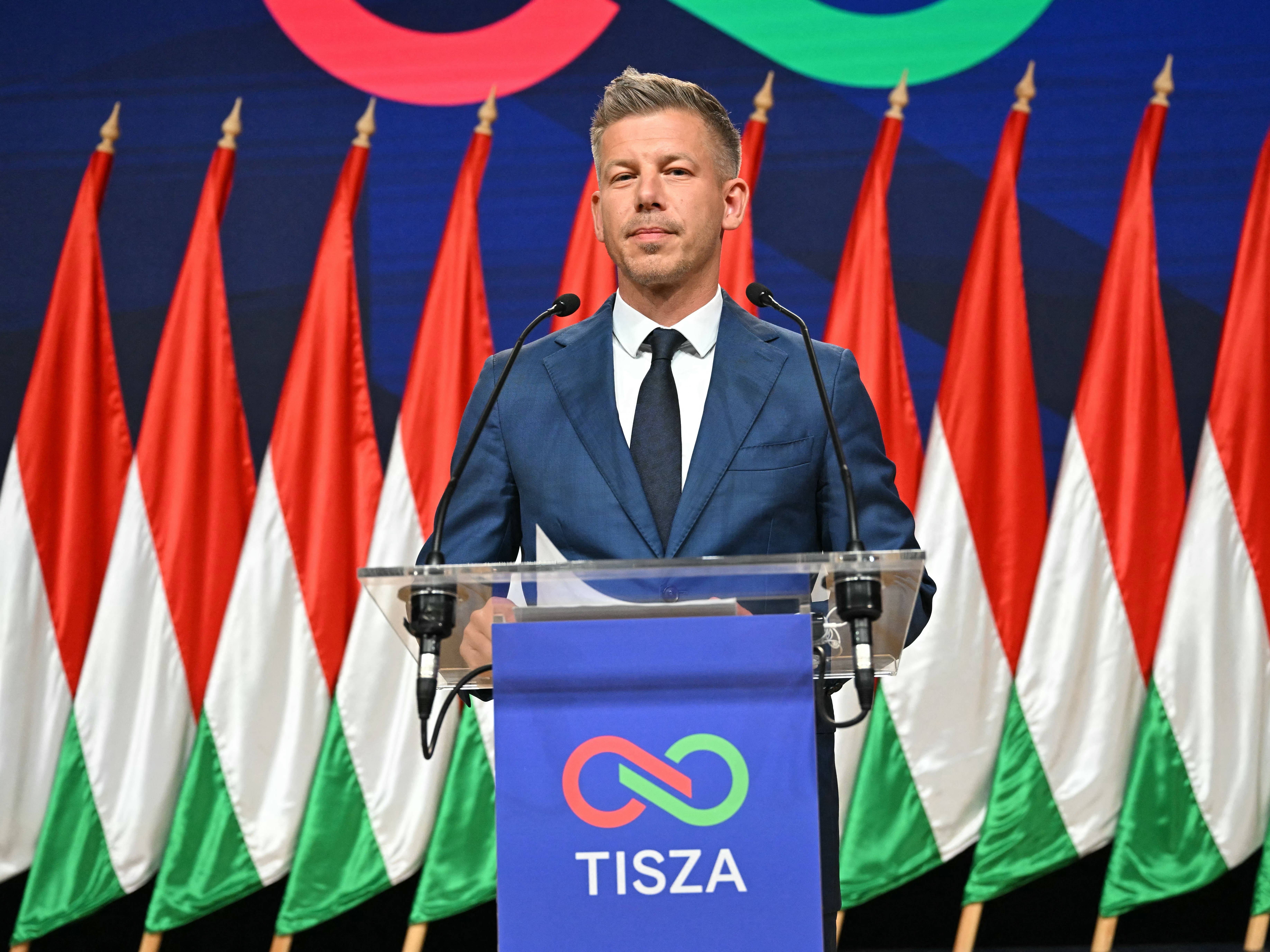 caption: Péter Magyar, leader of the pro-European conservative Tisza party, speaks at a Monday press conference the day after his landslide election victory.