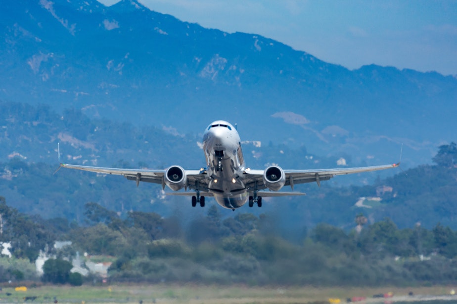 caption: An Alaska Airlines flight takes off in Santa Barbara. Alaska is one of two airlines that will be running flights from Everett's Paine Field beginning today.