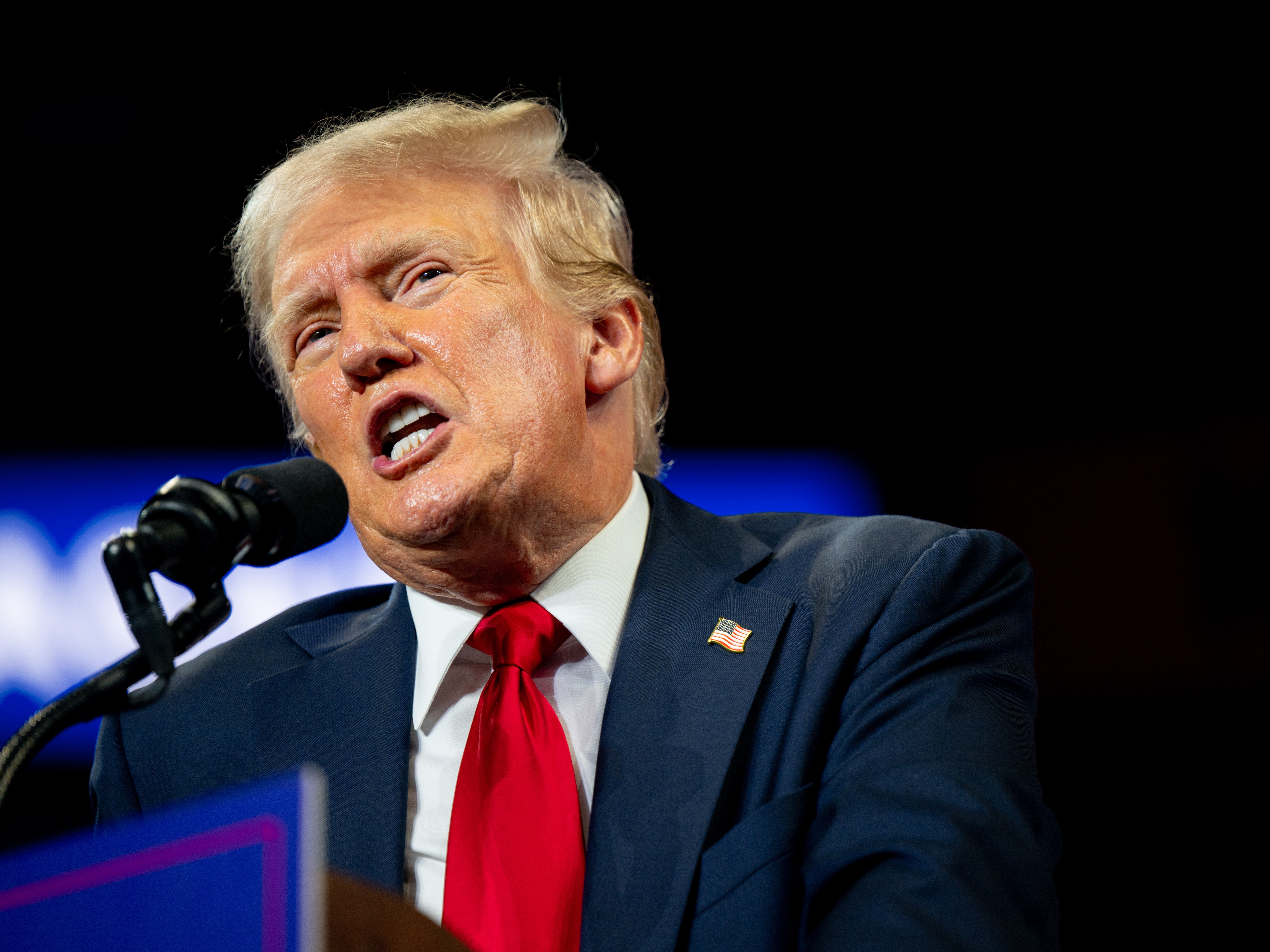 caption: Republican Presidential nominee, former President Donald Trump speaks to attendees during his campaign rally in Charlotte Wednesday. The rally is the former president's first since President Joe Biden announced he would be ending his reelection bid.