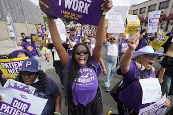 caption: Frontline health care workers hold a demonstration on Labor Day outside Kaiser Permanente Los Angeles Medical Center in Los Angeles, Monday, Sep. 4, 2023.