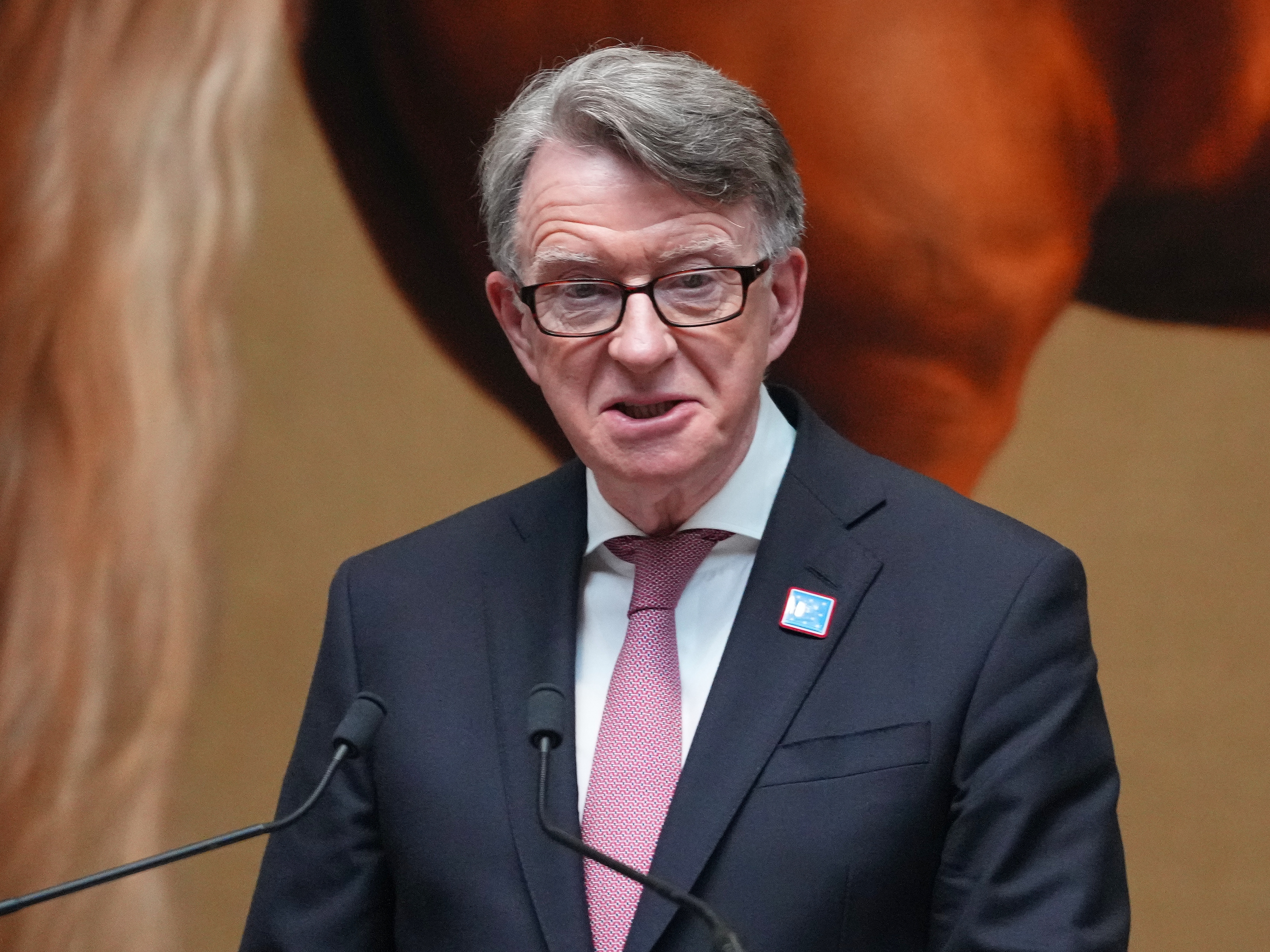 caption: Then-British Ambassador to the U.S. Peter Mandelson speaks during the rededication ceremony of the George Washington Statue in the National Gallery in London, June 18, 2025.