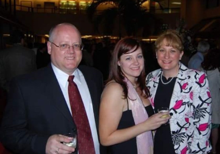 caption: From left: Matt Faber, Candace's father, Candace Faber, and her mother, Laura Lee Faber, the night of Candace's Georgetown graduation. She is wearing the dress she says Fain tore. 