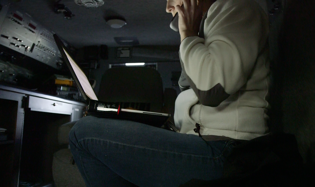caption: Detective Wendy Willette of Washington's Department of Fish and Wildlife in the police van. Willette heads an operation to unravel a shellfish black market that has sprung up in South Puget Sound.