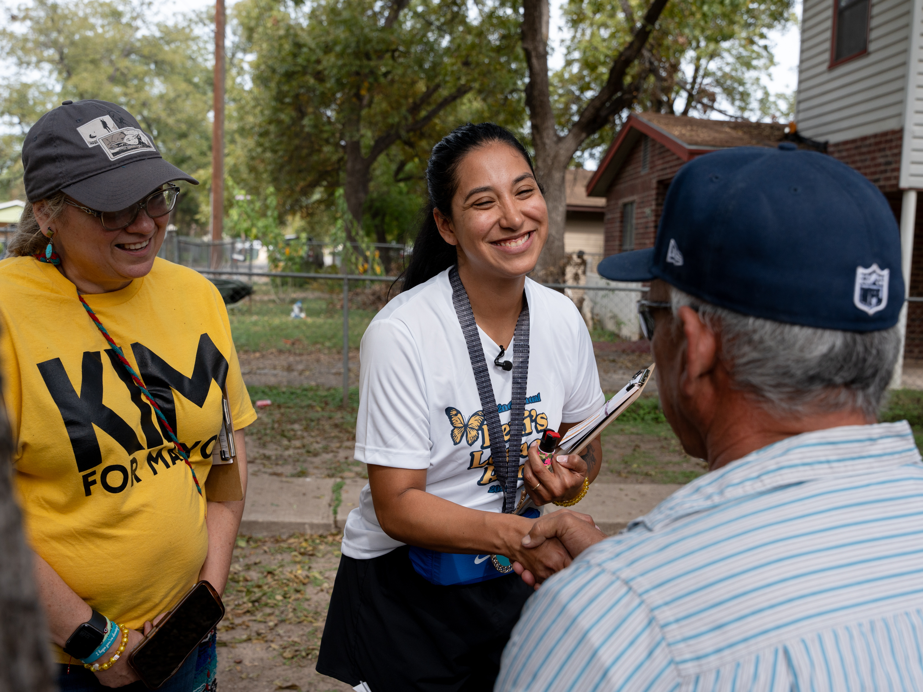 caption: Kimberly Mata-Rubio meets Uvalde residents during her block walk on Oct. 21.