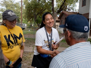 caption: Kimberly Mata-Rubio meets Uvalde residents during her block walk on Oct. 21.