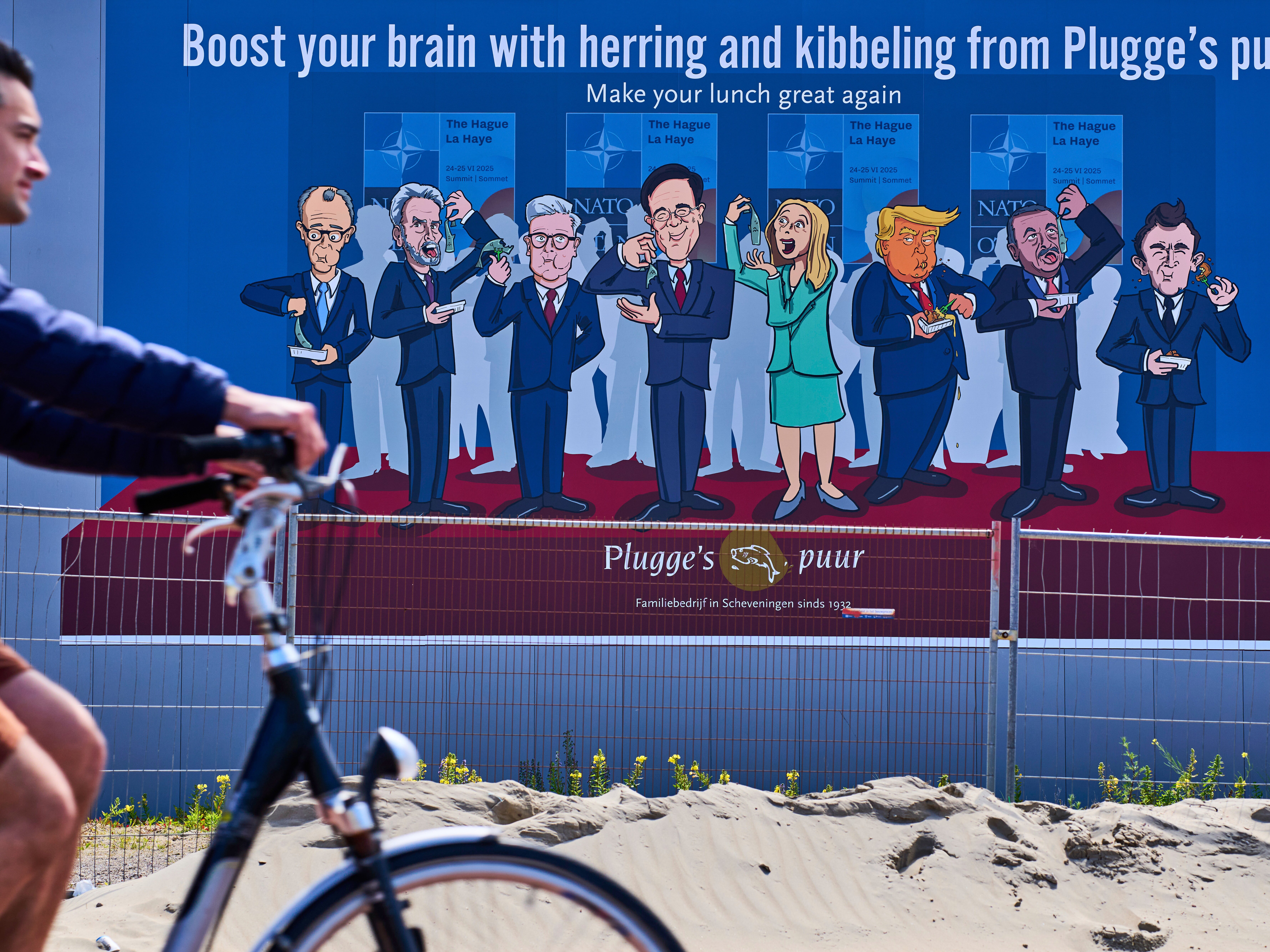 caption: A man on a bicycle passes a drawing of World leaders, including U.S. President Donald Trump, third right, in The Hague, Netherlands, Sunday, June 15, 2025.
