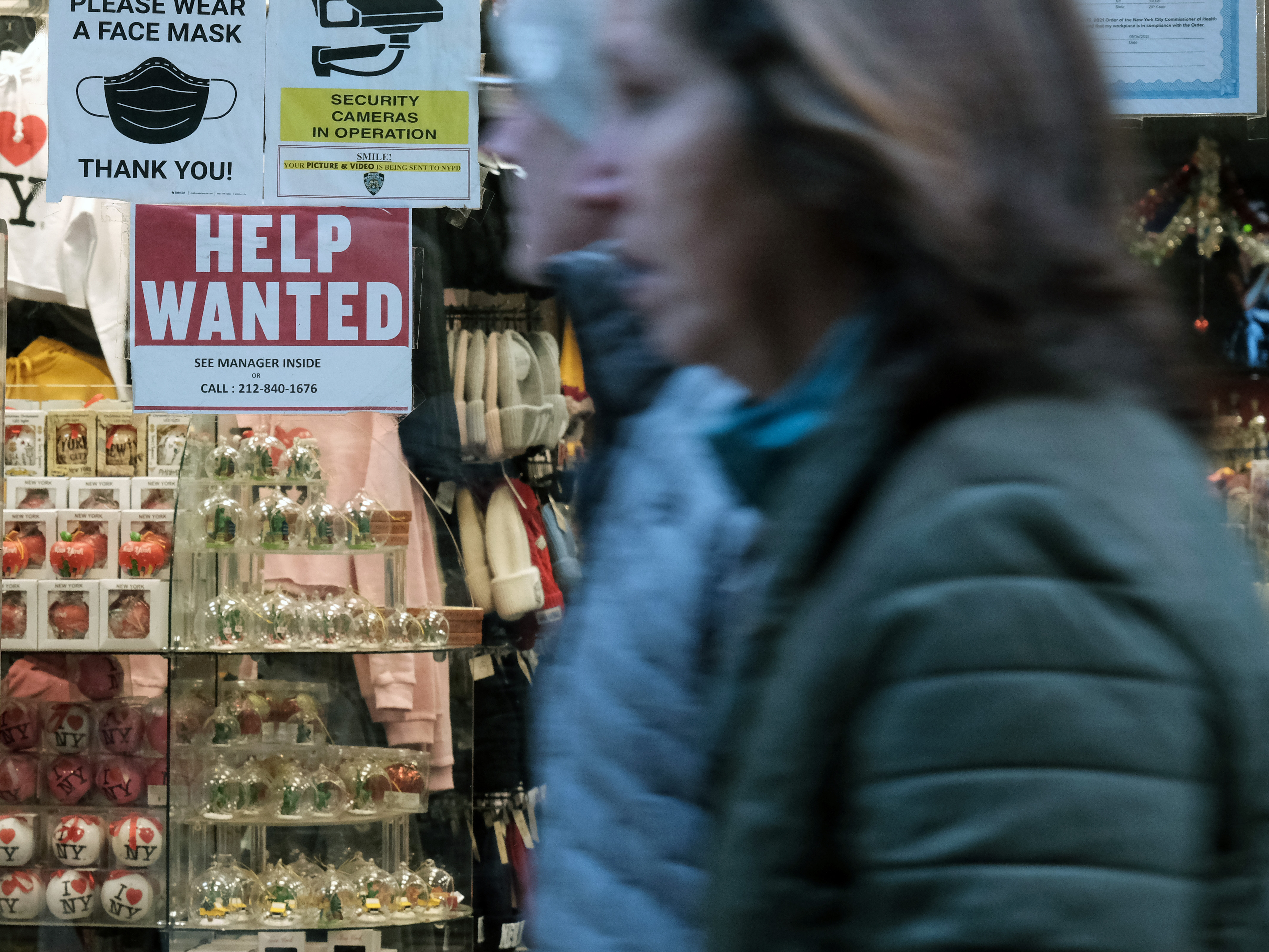 caption: A 'help wanted' sign is displayed in a window of a store in Manhattan, New York City, on Dec. 2, 2022. U.S. employers added an unexpectedly strong 517,000 jobs in January, showcasing the labor market is red-hot. The unemployment rate fell to its lowest level in more than half a century.