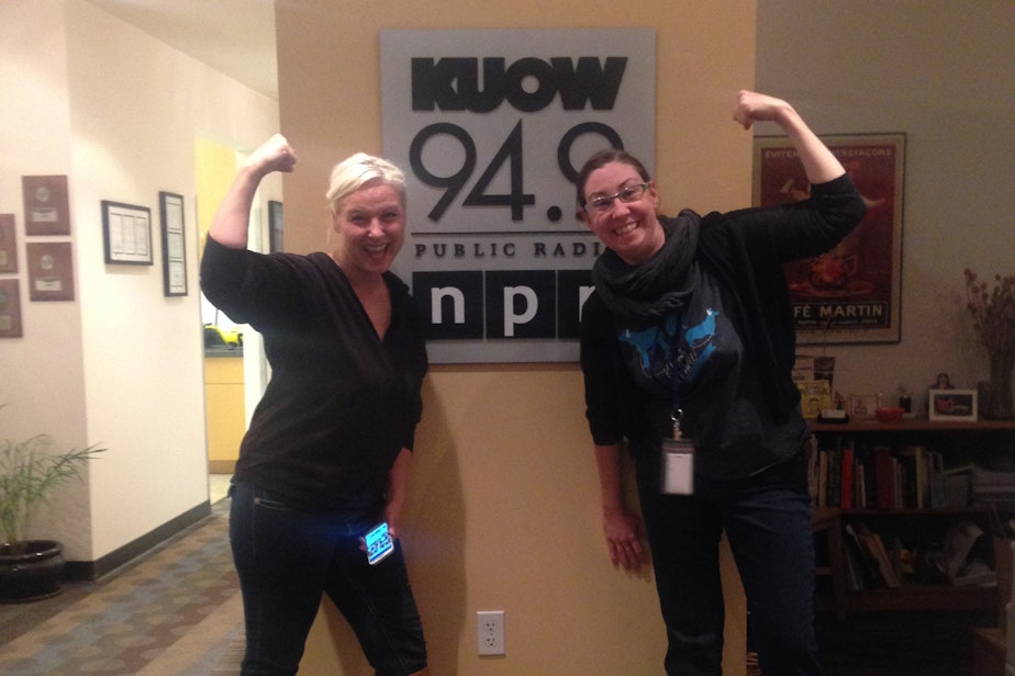 caption: Arm wrestler Stephanie Browning and KUOW&apos;s Jeannie Yandel show off their biceps at the KUOW studios.