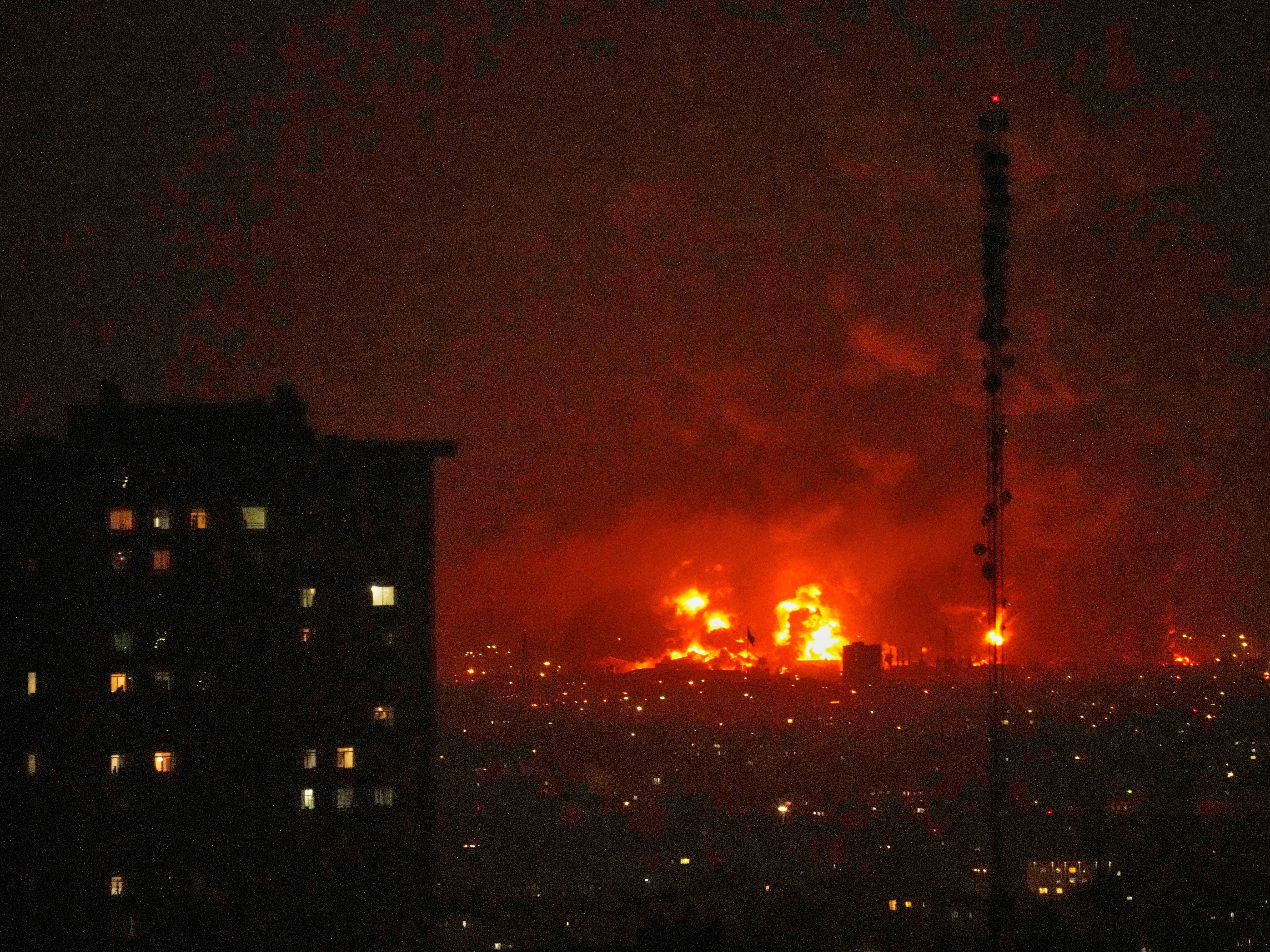 caption: Flames rise from an oil storage facility south of the capital Tehran as strikes hit the city during the U.S.–Israel military campaign, Iran, Saturday, March 7, 2026.