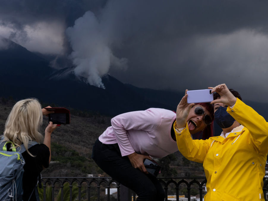 caption: Volcano tourism has overwhelmed La Palma as people come to see the spectacle.