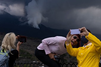 caption: Volcano tourism has overwhelmed La Palma as people come to see the spectacle.