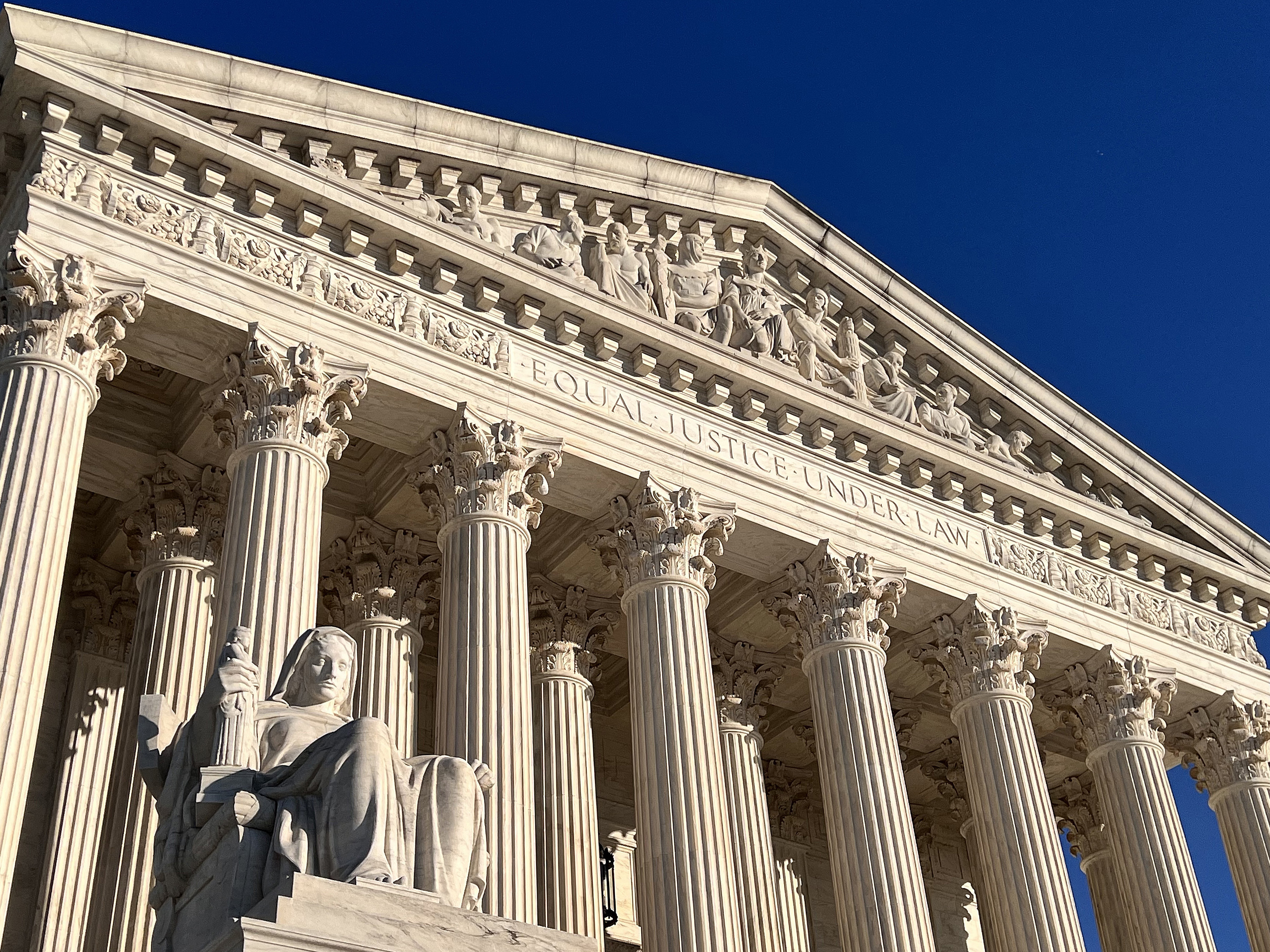 caption: President Biden has said he plans to make his mind up about who to nominate to the Supreme Court by the end of February.