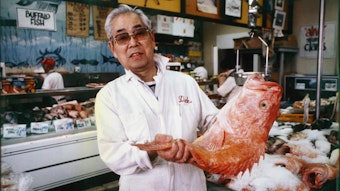 caption: Dick Yoshimura (pictured here in 1984) founded the Mutual Fish Company in 1947 and is credited with the region's first live seafood tanks and other innovations. Son Harry Yoshimura runs the business now, still a favorite of chefs as well as home cooks.