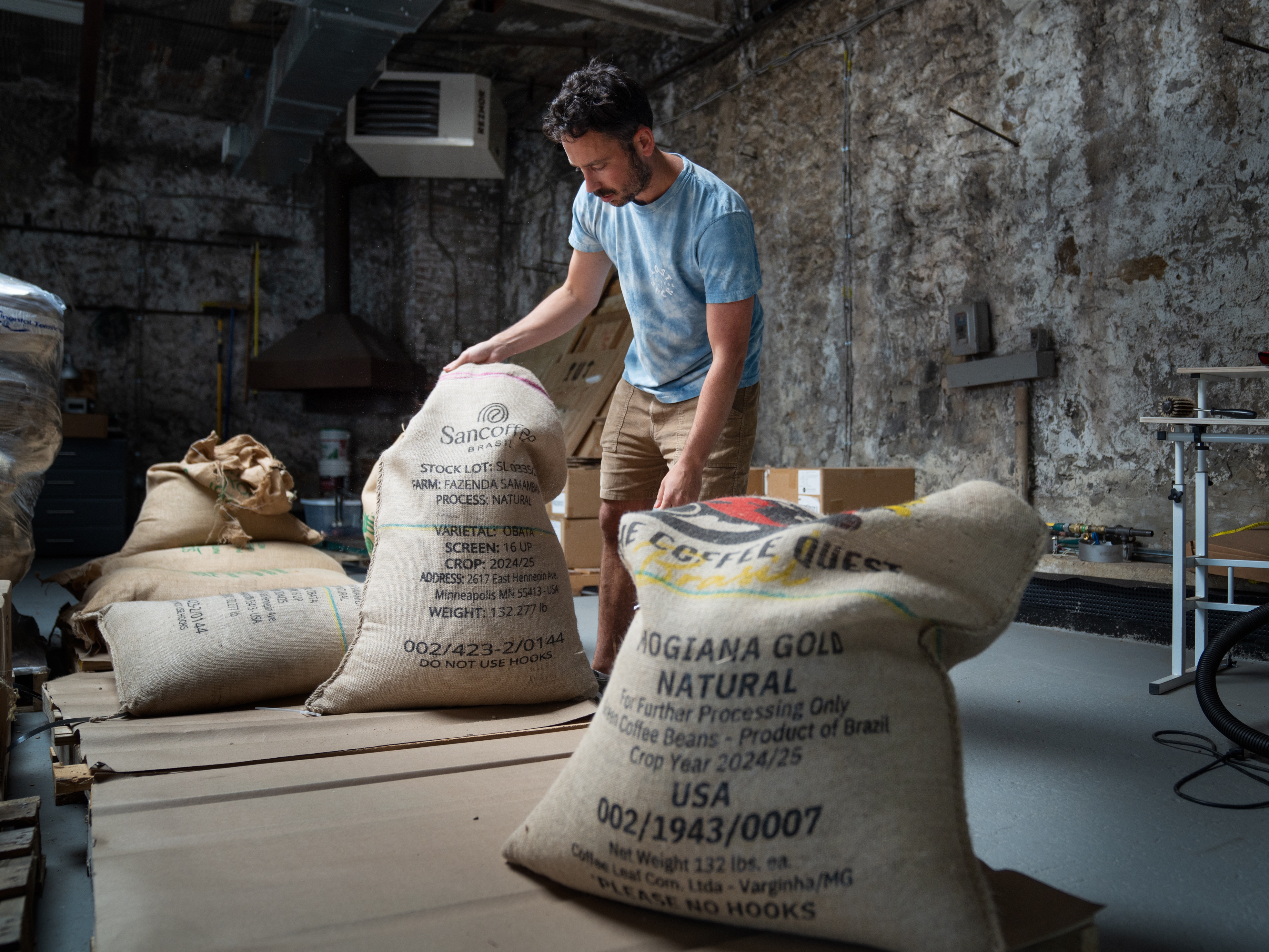 caption: Jeff Yerxa, co-owner of Lost Sock Roasters, shows bags of coffee beans, many from Brazil, at the company's warehouse in Washington, D.C. The looming threat of a 50% tariff on all goods from Brazil — the world's largest coffee producer — has sent shock waves through the U.S. coffee industry.