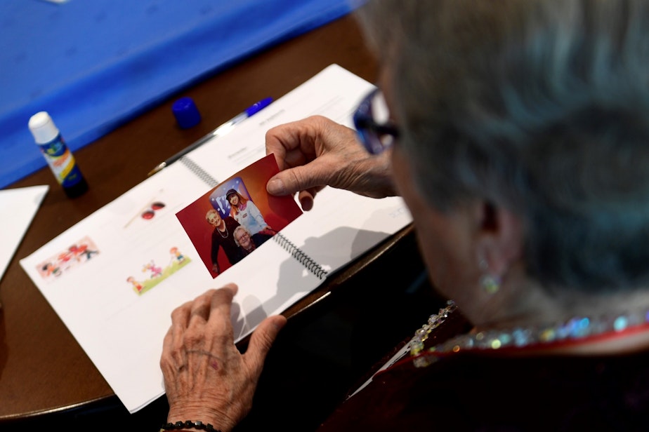 caption: A patient affected by Alzheimer's disease attends a special therapeutic session. (Pierre-Philippe Marcou/Getty Images)