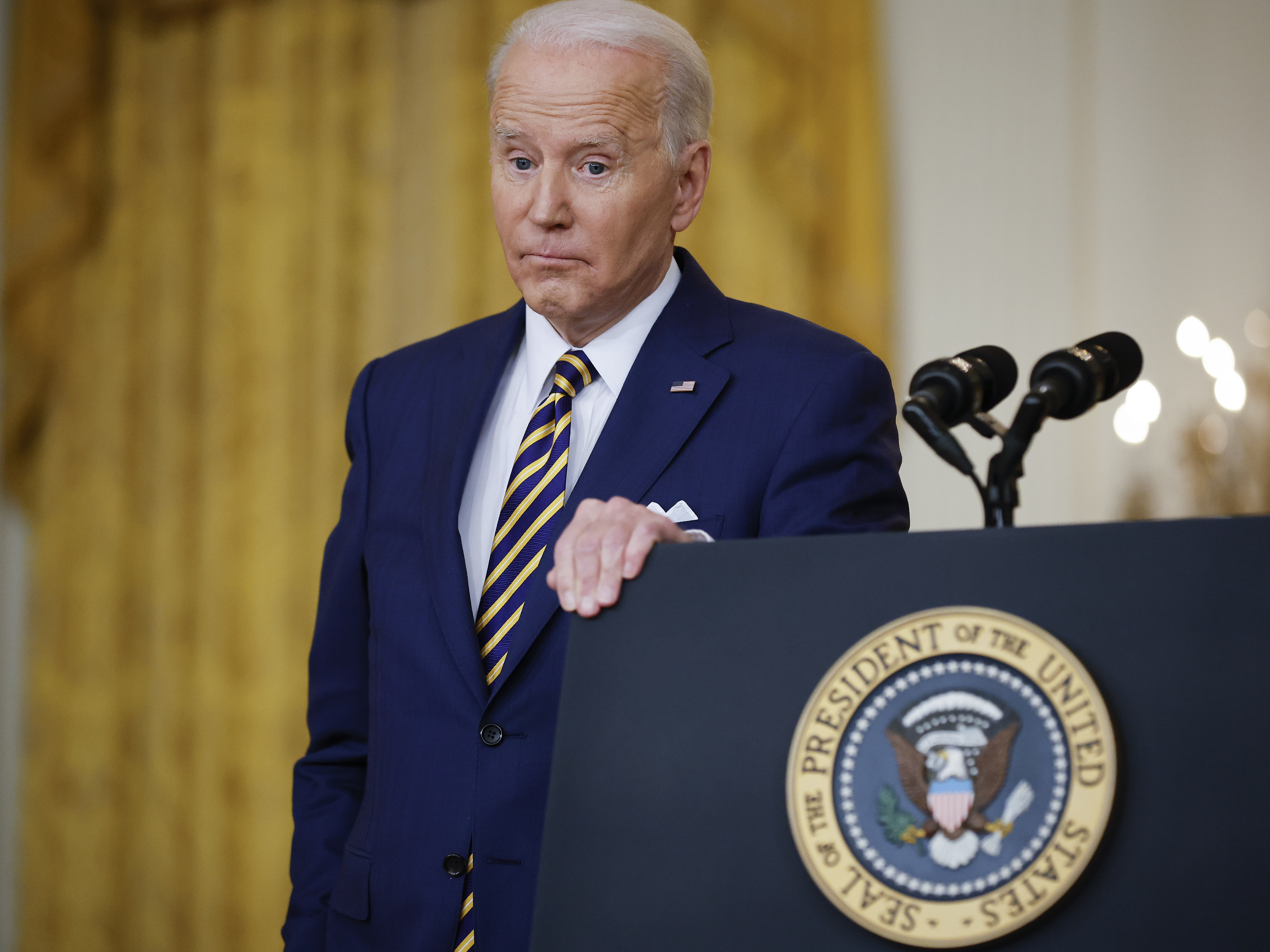 caption: President Biden answers questions during a White House news conference on Wednesday.