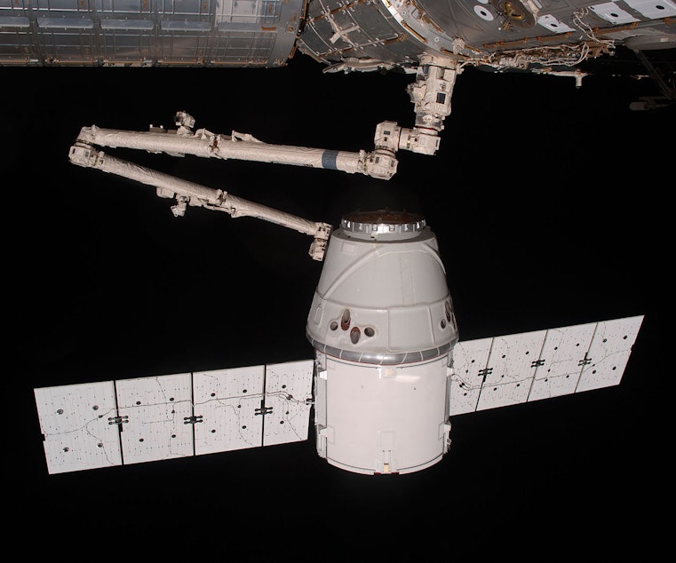 caption: Dragon, SpaceX's version of an astronaut taxi to the International Space Station. The company announced it would be opening up a new office in Seattle for 1,000 employees. Boeing is also getting in the space technology game with a rival spacecraft.