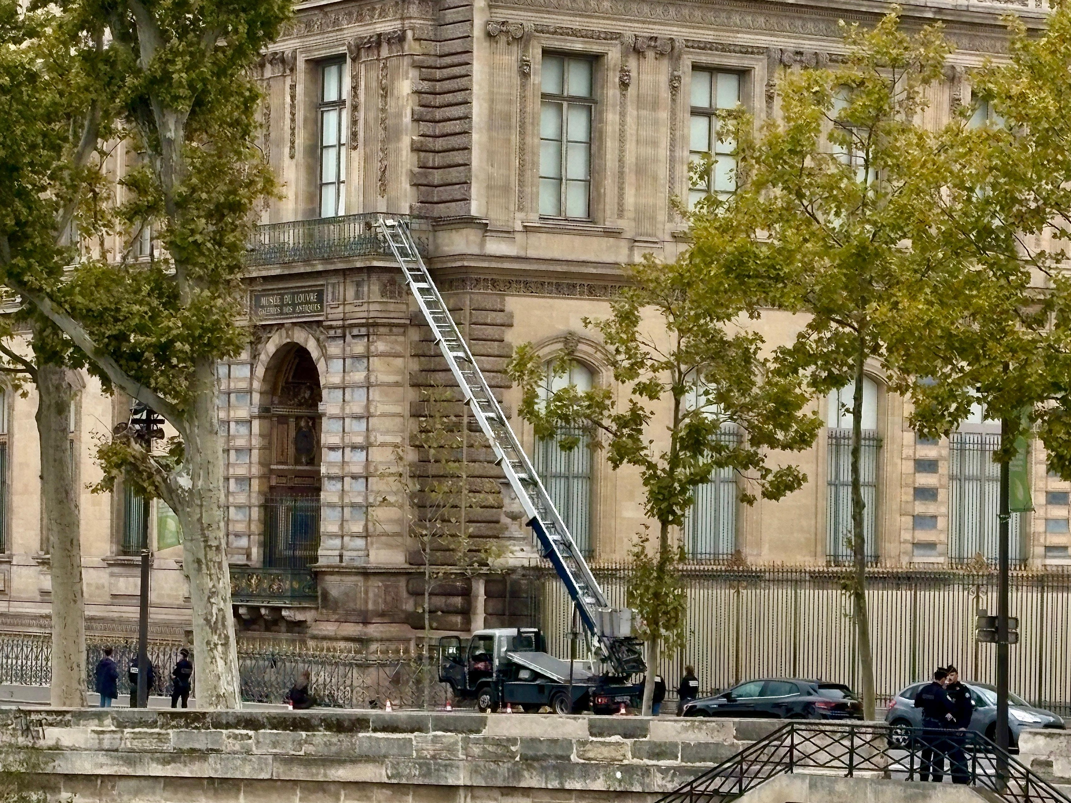 caption: A basket lift used by thieves is seen at the Louvre museum on Sunday in Paris.