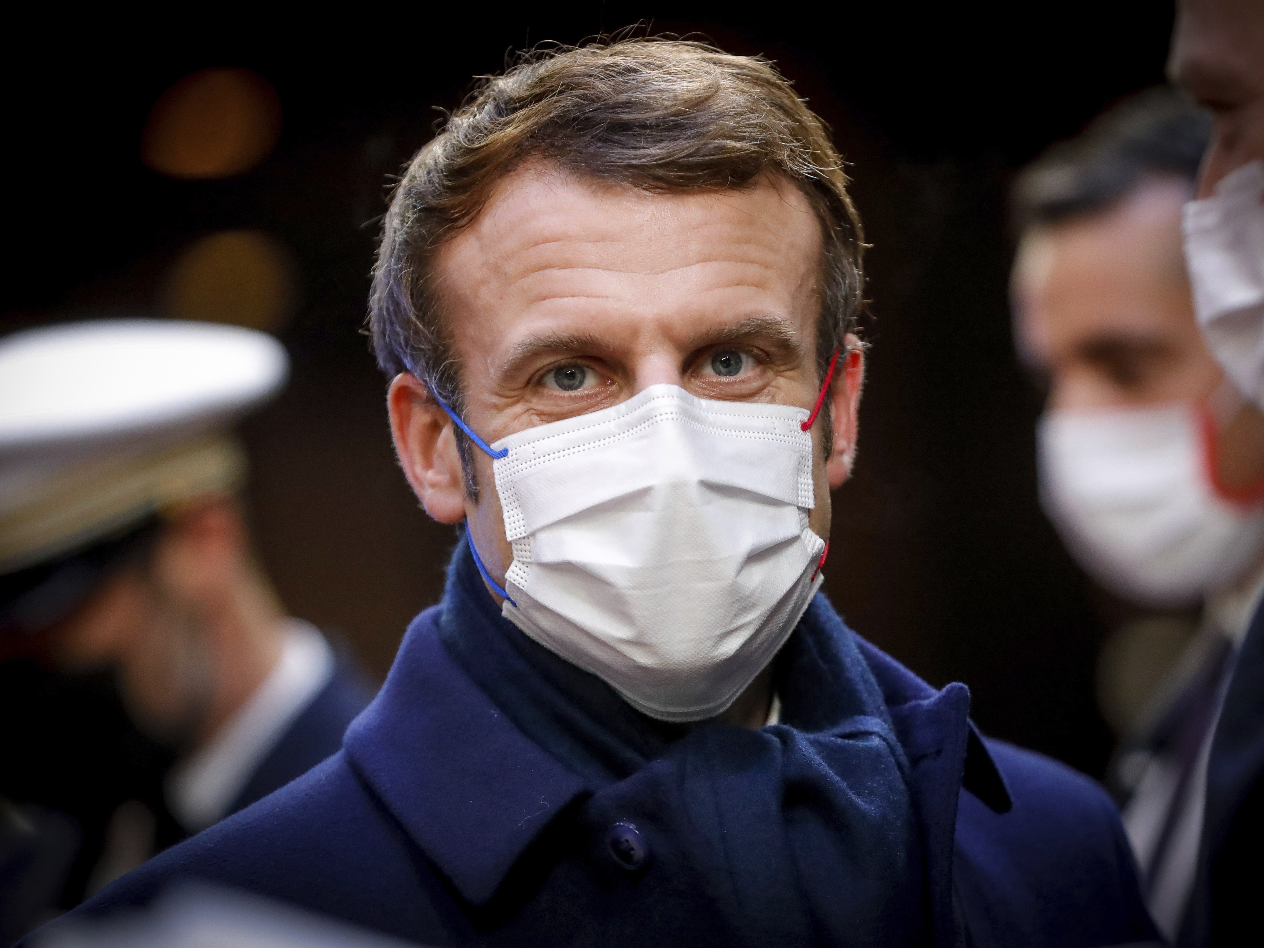 caption: French President Emmanuel Macron during departures at the end of an EU Summit in Brussels, last month. Macron told a French newspaper this week that he wanted to "piss off" the unvaccinating, drawing the ire of opposition politicians.