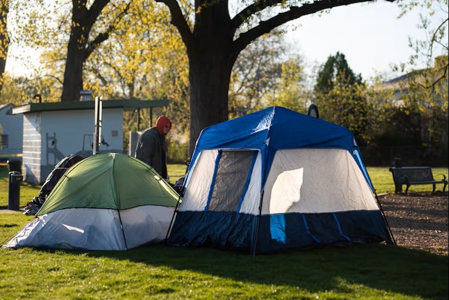 caption: An ordinance passed in February designated Foster Park as the only place for overnight camping in Clarkston and made it illegal to have a tent or temporary shelter set up between the hours of 7 a.m. and 9 p.m. Since then, police have issued 11 citations for trespassing at the park.
