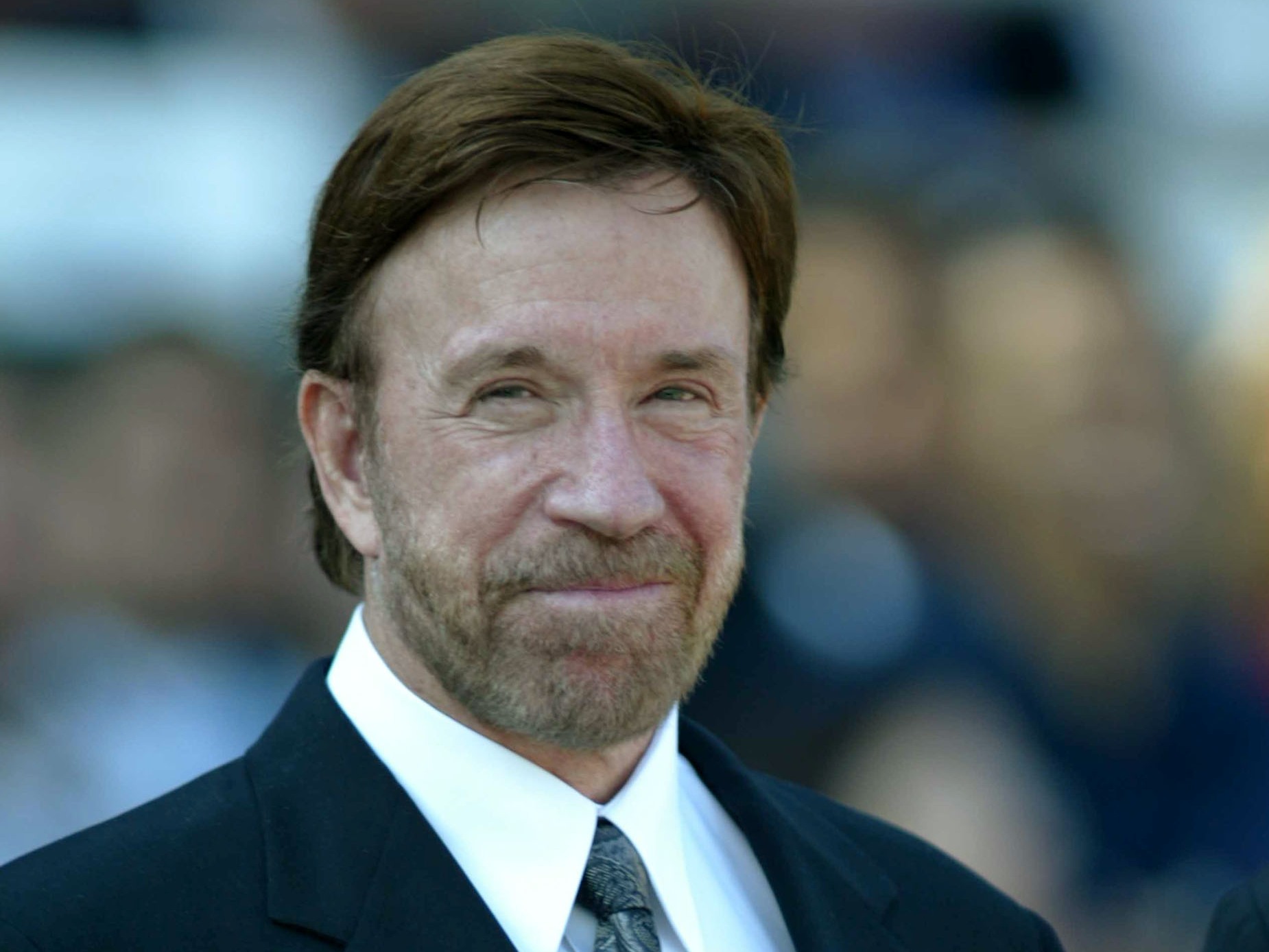caption: Norris karate chopped and kickboxed his way through more than a dozen action films in the 1980s, before leaping to TV in <em>Walker, Texas Ranger. </em>He's pictured above in California in October 2003.