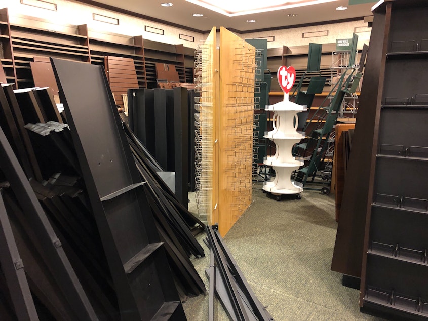 caption: Disassembled store shelves at Barnes & Noble in downtown Seattle.