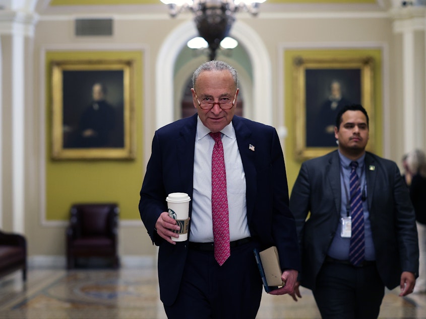 caption: Senate Majority Leader Charles Schumer of New York walks to his office at the U.S. Capitol on Thursday.