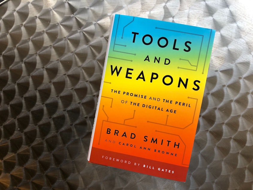 caption: "Tools and Weapons: The Promise and the Peril of the Digital Age" by Brad Smith and Carol Ann Browne.