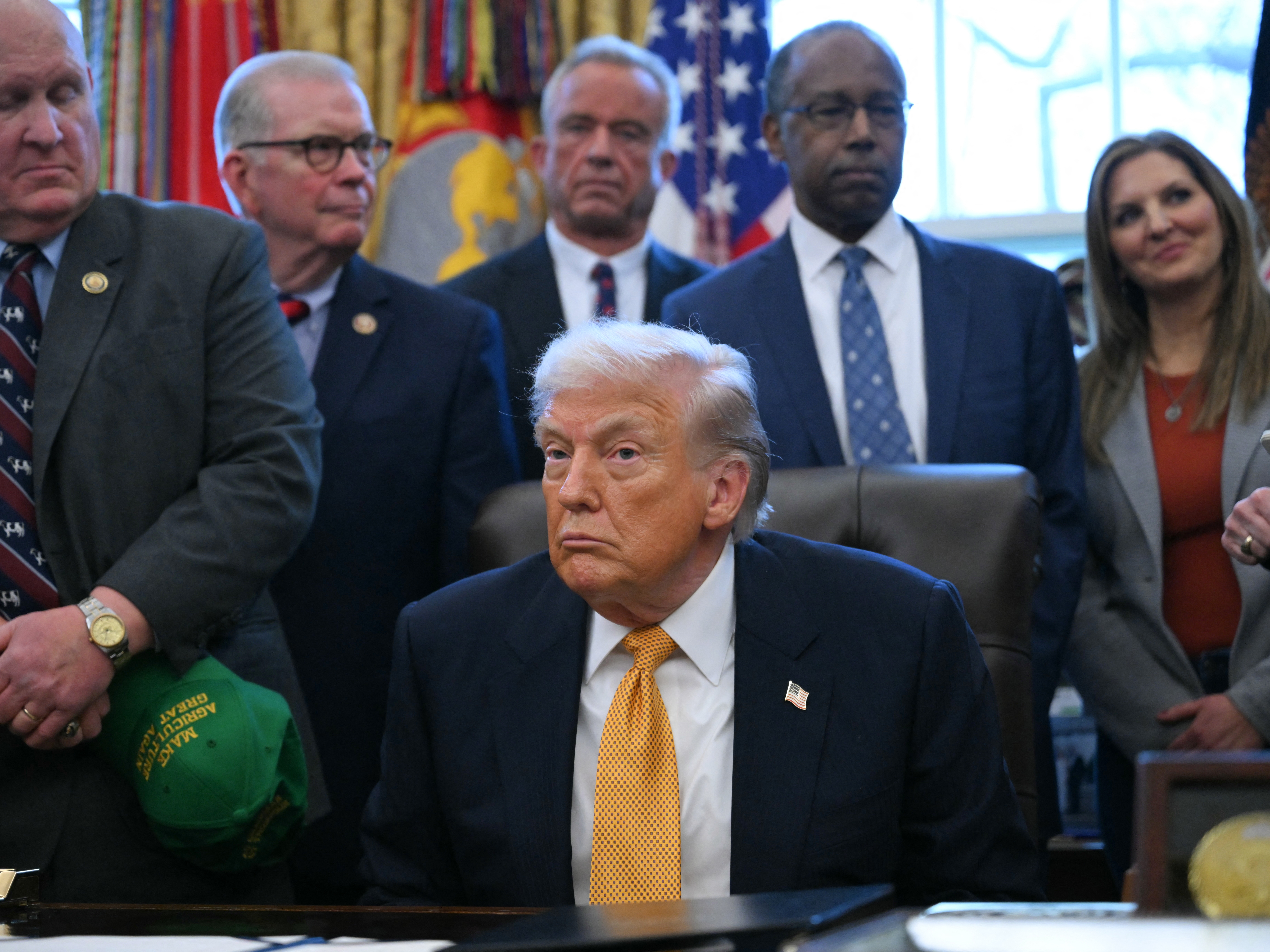 caption: President Trump in the Oval Office on Wednesday. On Thursday, he made a health care announcement via a social media video.