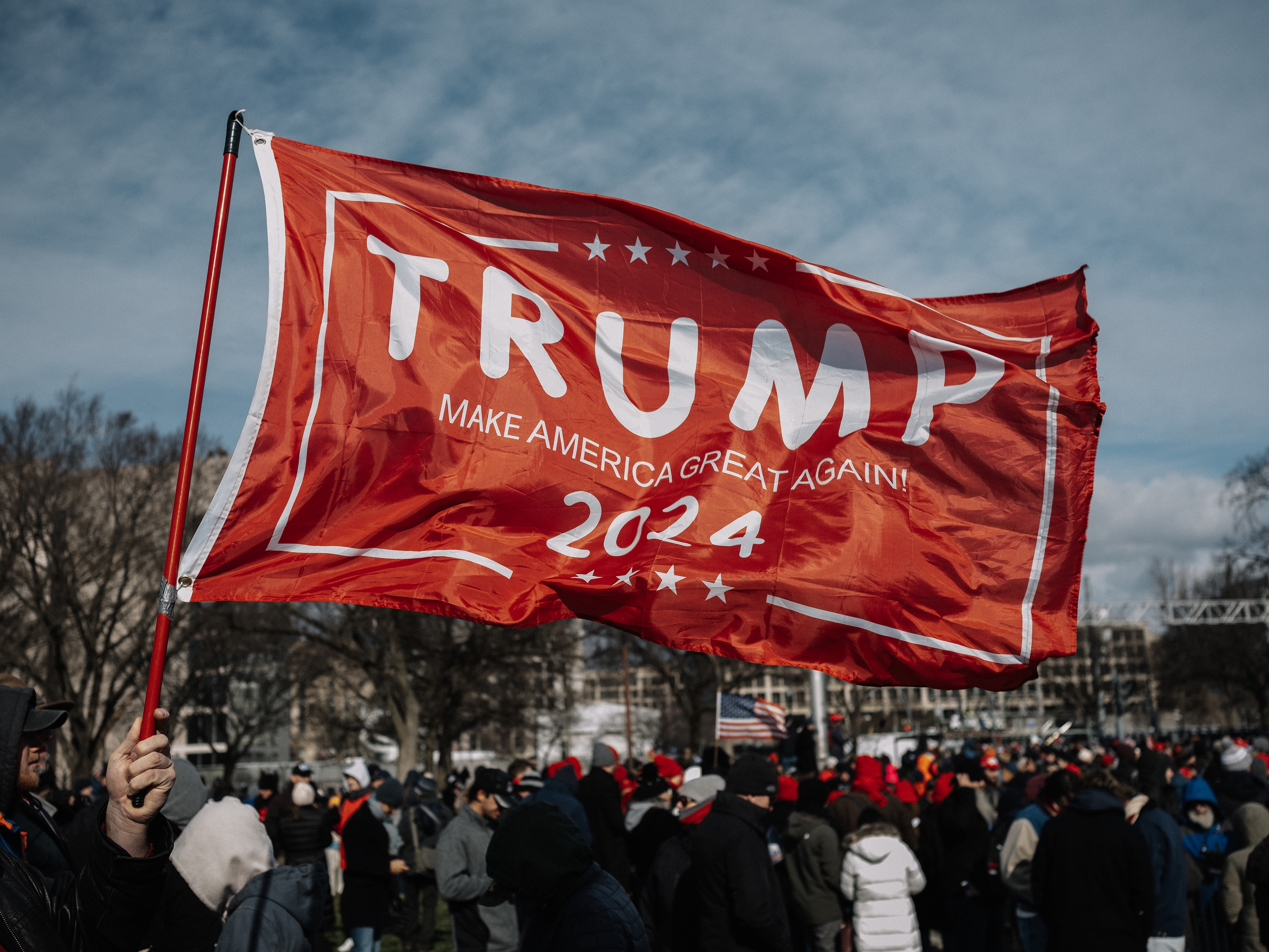 caption: Pro-Trump supporters gather at the National Mall before the inauguration of the President Trump on January 20 in Washington, DC.