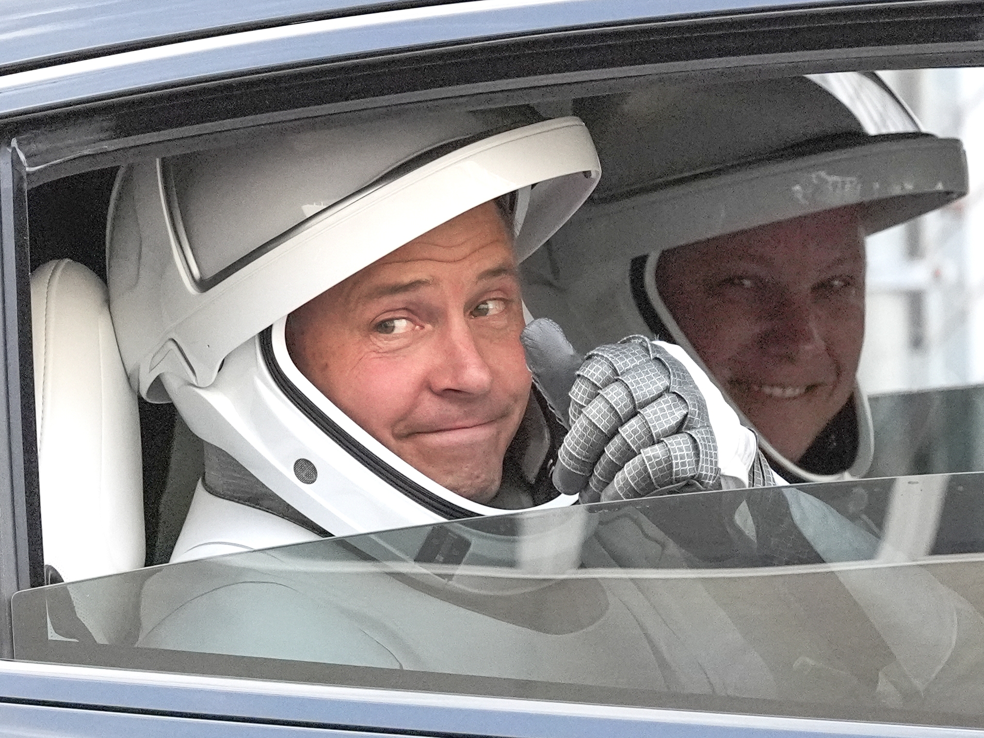 caption: NASA astronaut Nick Hague, left, and Roscosmos cosmonaut Aleksandr Gorbunov are pictured as they leave the Operations and Checkout Building on their way to Launch Complex 40 for a mission to the International Space Station  on Saturday in Cape Canaveral, Fla. 