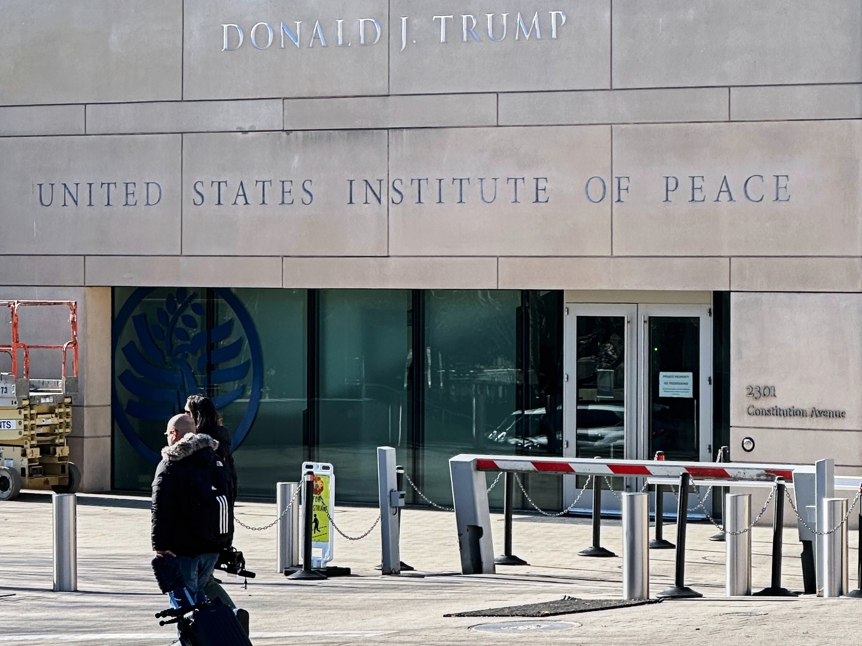 caption: President Donald Trump's name is seen on the United State Institute of Peace building, Wednesday, Dec. 3, 2025 in Washington.