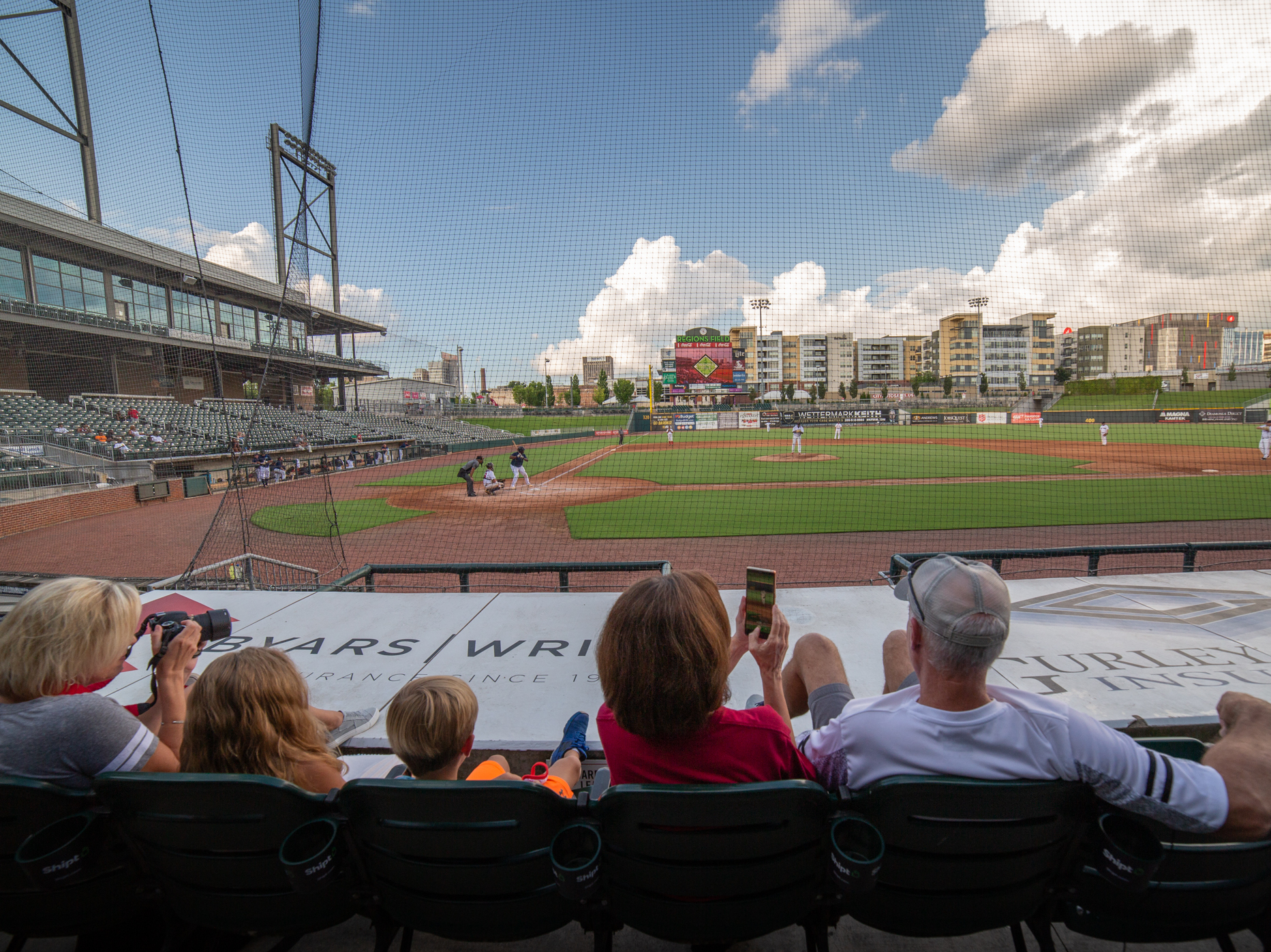caption: Dozens of fans turned out to watch the Red Sox amateur baseball team tangle with the Yankees at Regions Field in Birmingham, Ala. The teams are part of an over-35 league showcasing their skills at a ballpark normally used by the Birmingham Barons minor league baseball team.