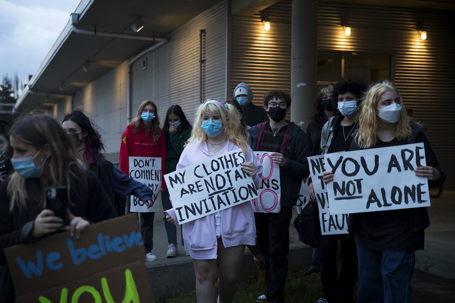 caption: Students from multiple high schools gathered in protest of how cases of sexual assault are handled outside of the  Seattle Public Schools school board meeting on Wednesday, December 1, 2021, along 3rd Avenue South in Seattle. 