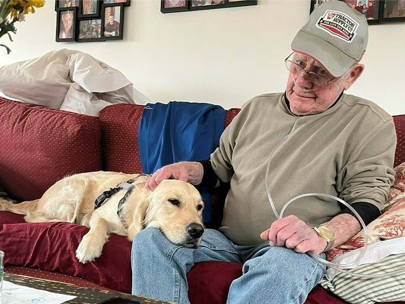 caption: Howard Houlden got hospital-at-home care for covid, COPD and congestive heart failure. Though he has since died, his daughter, Lori Girard, says it likely extended his life and helped him enjoy himself.