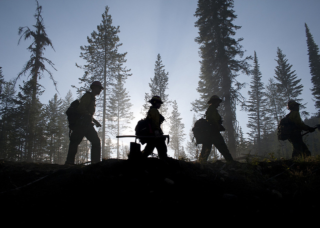 caption: Firefighters battling a wildfire in Washington last year. 